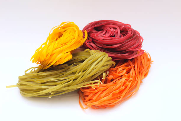 istock Isolated colored spaghetti nests on a white background 1205910931