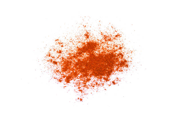 istock Red chili pepper powder isolated on white background 1205911417