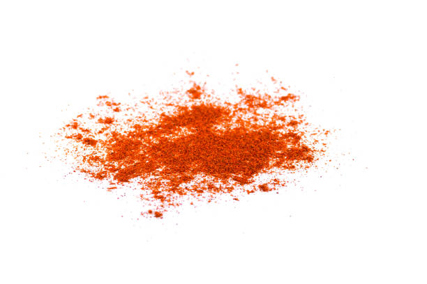 istock Red chili pepper powder isolated on white background 1205911448