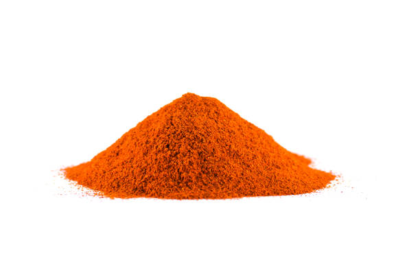 istock Red chili pepper powder isolated on white background 1205911461