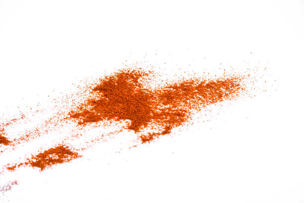 istock Red chili pepper powder isolated on white background 1205911479