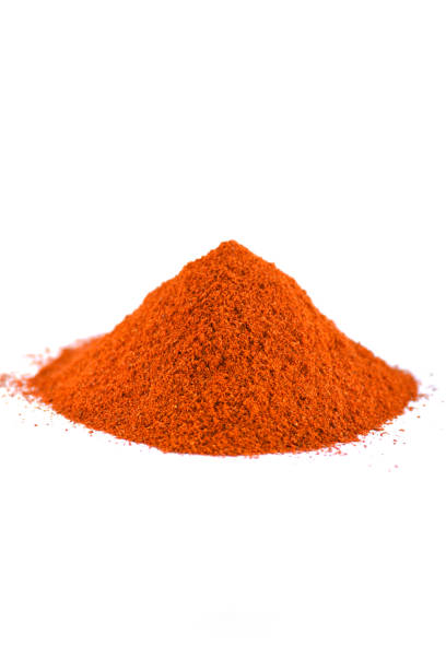 istock Red chili pepper powder isolated on white background 1205911539