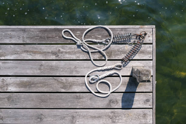 Beautiful dry weathered rustic wooden jetty in warm summer light