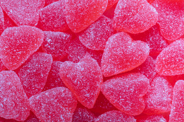Jelly candy hearts full frame background Pink jelly candy hearts with sugar, full frame background. Swedish traditional Valentines day candy. gummy candy photos stock pictures, royalty-free photos & images