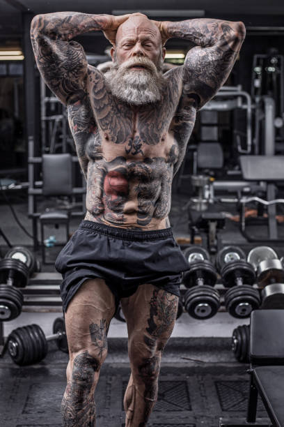 istock Tattooed Senior Man During Gym Workout 1205915703