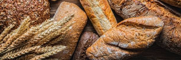 istock Still life with breads and wheats, Close-up panoramic image 1205916594