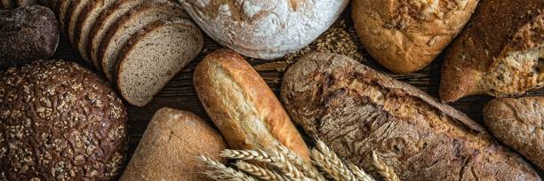 istock Still life with breads and wheats, Close-up panoramic image 1205916674
