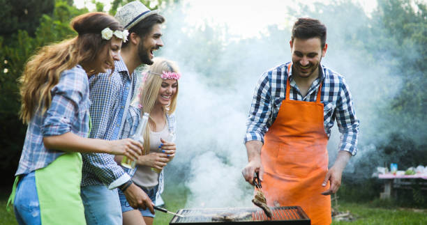 istock Happy people having camping and having bbq party 1205918122