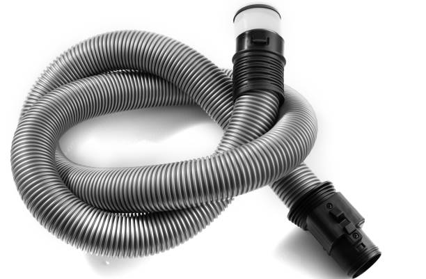 istock Black plastic pipe from a vacuum cleaner on a white background. 1205918479