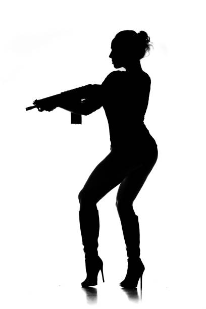 istock Sexy Female Gangster Silhouette 1205919238