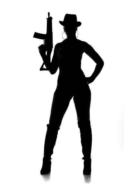 istock Sexy Female Gangster Silhouette 1205919728