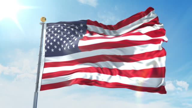 United States flag waving in the wind against deep blue sky. National theme, international concept. 3D Render Seamless Loop 4K