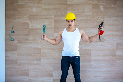 Asian handsome figure expert in home repair Repairing various parts of the house