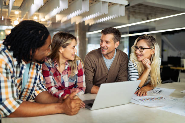 istock Happy creative designers, business people brainstorming in office 1205921209
