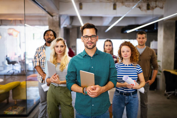 istock Successful company with happy employees in modern office 1205921251