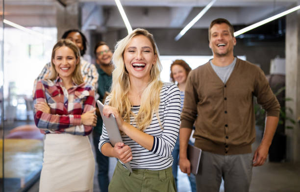 istock Successful company with happy employees in modern office 1205921264