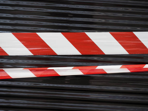 istock red and white barrier tape 1205922583