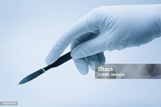 Surgeon Hand With Scalpel During Surgery Stock Photo - Download Image Now - Surgery, Scalpel, Healthcare And Medicine