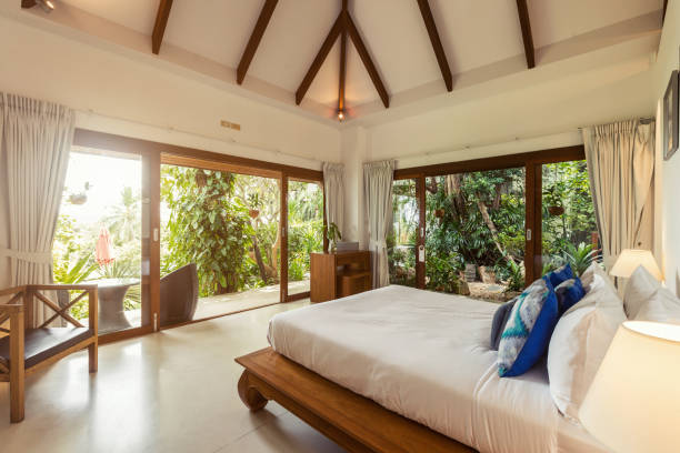 istock Modern bed room interior in Luxury villa. White colours, big window 1205924199