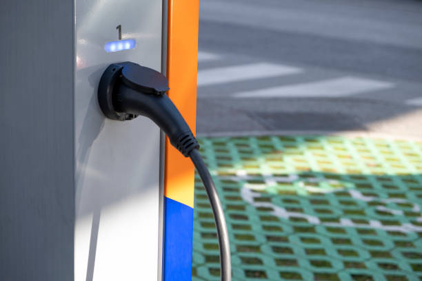 istock Electric plug for Car charging in the downtown parking lot 1205924295