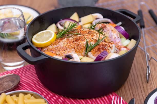 istock Preparing a whole chicken to cook in a Dutch Oven one pot 1205924447