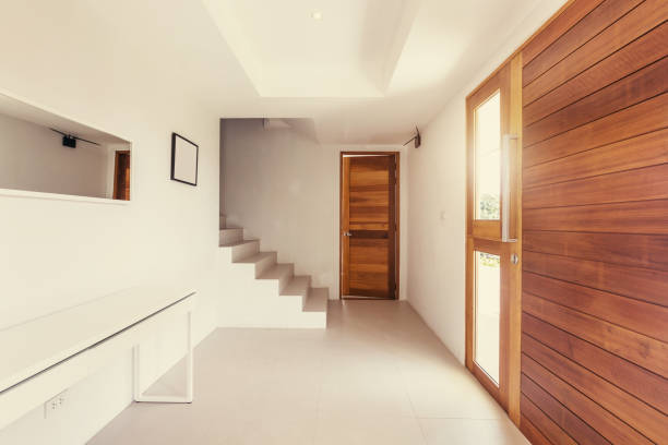 istock hallway modern interior, wood and white color design 1205924656
