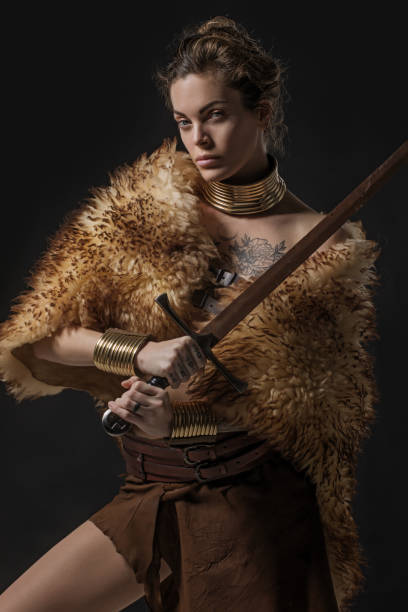 istock Blonde viking warrior female in studio shot 1205924790