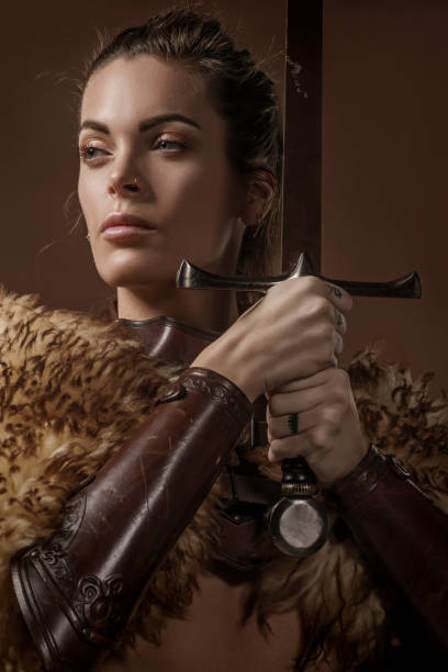 istock Blonde viking warrior female in studio shot 1205925368