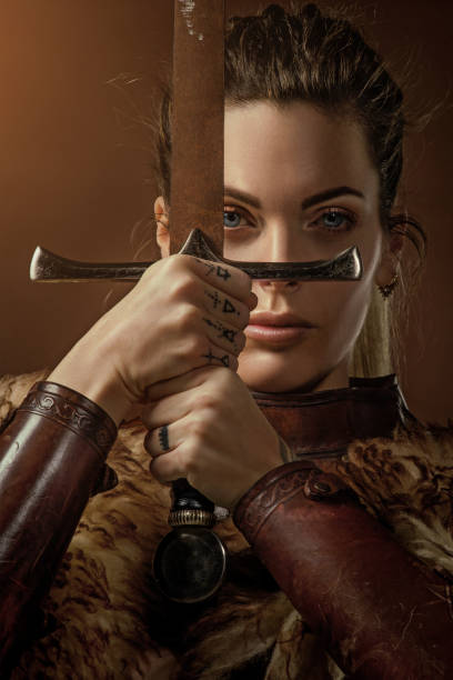 istock Blonde viking warrior female in studio shot 1205925413