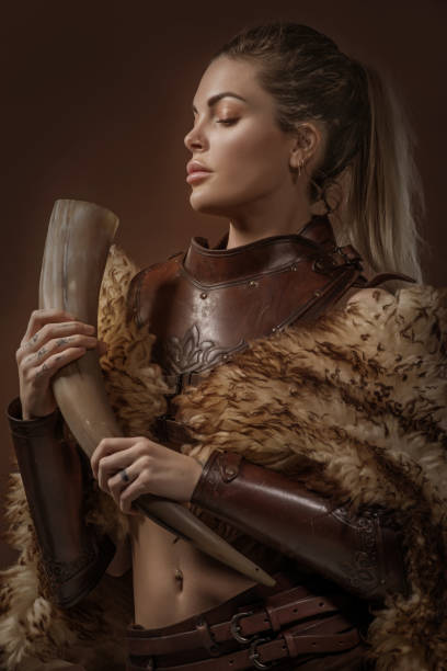 istock Blonde viking warrior female in studio shot 1205925439