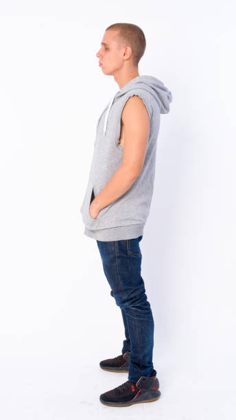 istock Full body shot profile view of young bald rebellious man 1205925903