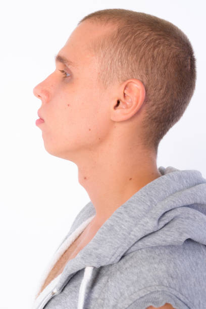 istock Closeup profile view of young bald rebellious man 1205925938