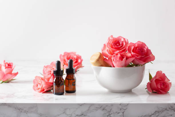istock essential oils in bottles rose flowers. alternative medicine aromatherapy 1205931878
