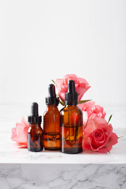 istock essential oils in bottles rose flowers. alternative medicine aromatherapy 1205931926