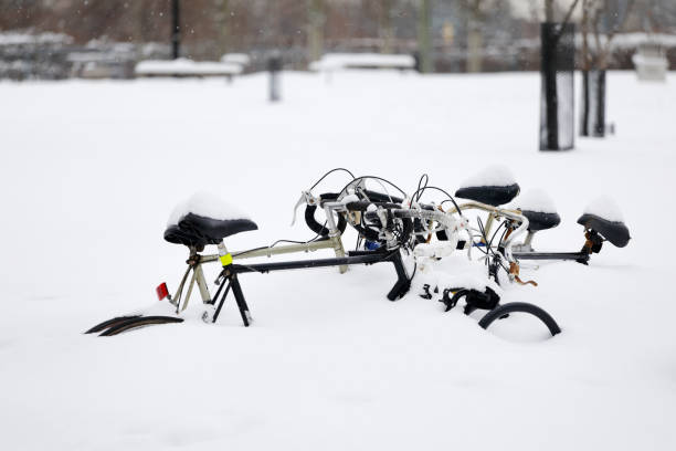 istock Street in Montreal with bicycles covered in snow 1205933348