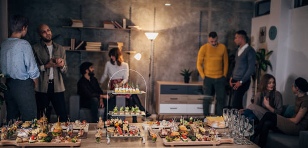 istock Business colleagues at corporate office party 1205933625
