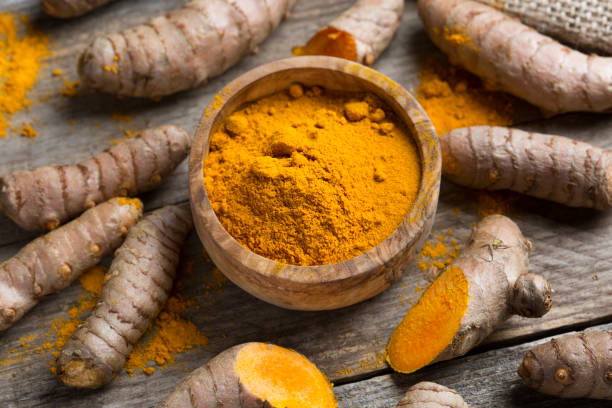 istock Curcuma longa, powder and rhizomes 1205933889