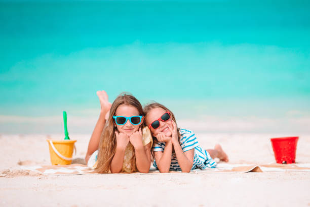 istock Little girls on the beach during summer vacation 1205940327