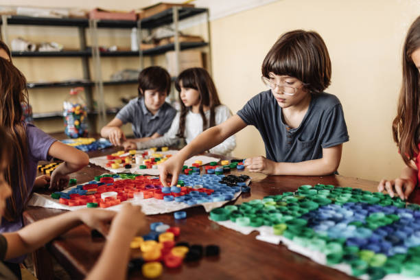 istock primary school children in Latin America having art and craft class 1205945136