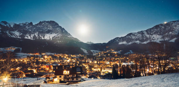 istock Shining village lights getting brighter and brighter as the sun sets. 1205948289
