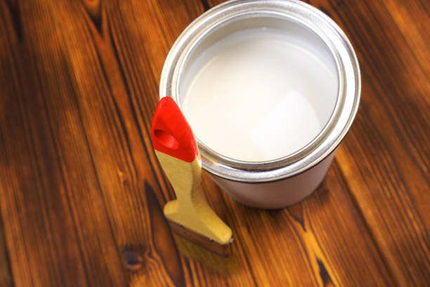 istock House renovation, paint can on the old wooden background with copy space 1205948950