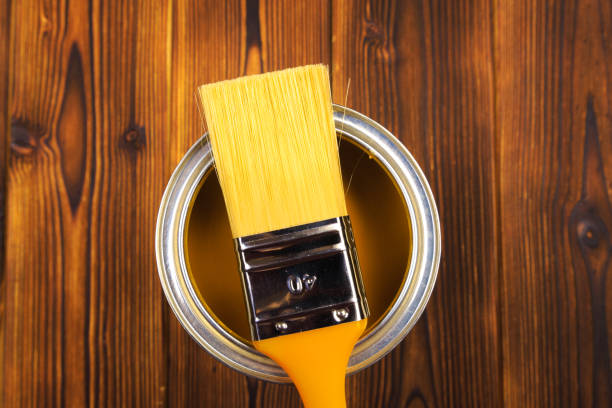 istock House renovation, paint can on the old wooden background with copy space 1205949086