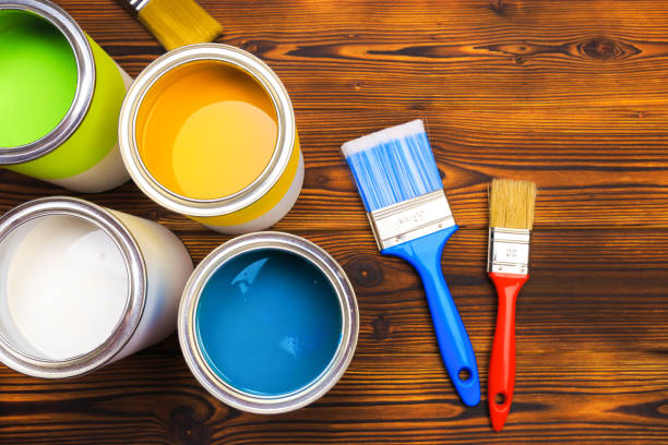 istock House renovation, paint cans on the old wooden background with copy space 1205949211