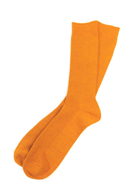 calcetines amarillos sobre fondo blanco aislado - new wool fotografías e imágenes de stock