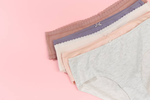 istock Female panties over pink  background 1205949284