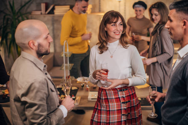 istock Business colleagues at corporate office party 1205949456