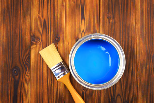istock House renovation, paint can on the old wooden background with copy space 1205949607