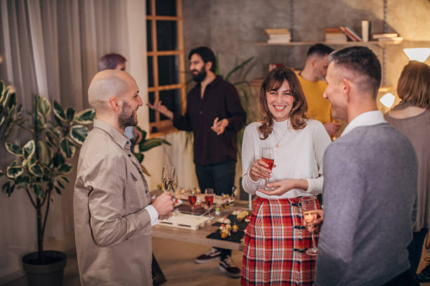 istock Business colleagues at corporate office party 1205949694