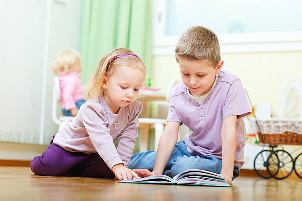 istock Brother and sister reading 120595078