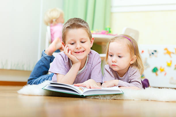 istock Brother and sister reading 120595128